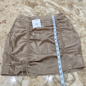 Adika Ruched Mini Skirt. Tan. Size small. NWT